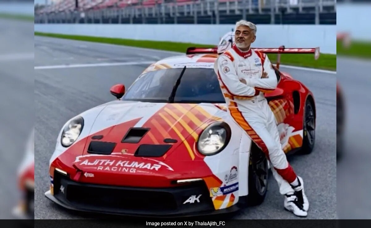 Crazy Viral: Ajit Kumar posing with his race car at the Barcelona F1 circuit. view photos